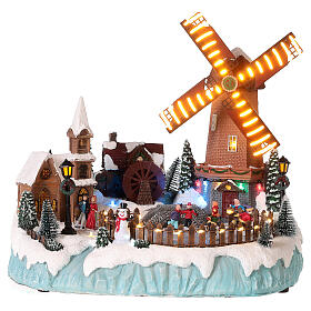 Village de Noël avec moulins et patineurs 35x35x30 cm