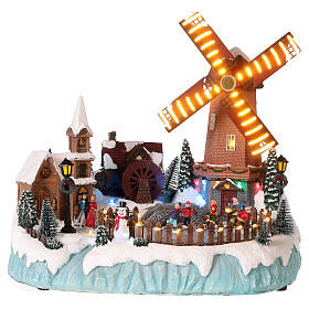 Christmas village with mill and skaters 35x35x30 cm