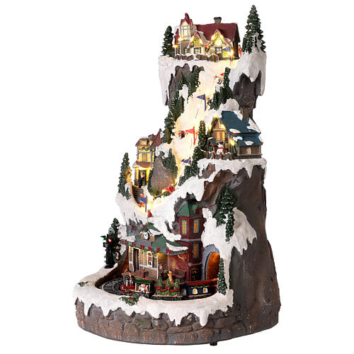 Villaggio Natalizio montagna con sciatori e treno 50x30x30 cm 4