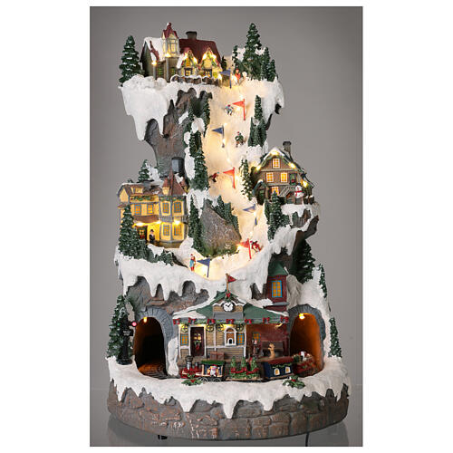 Mountain Christmas village with skiers and train 50x30x30 cm 2