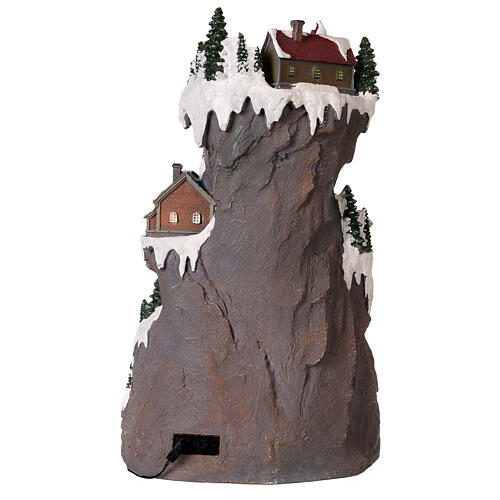 Mountain Christmas village with skiers and train 50x30x30 cm 7