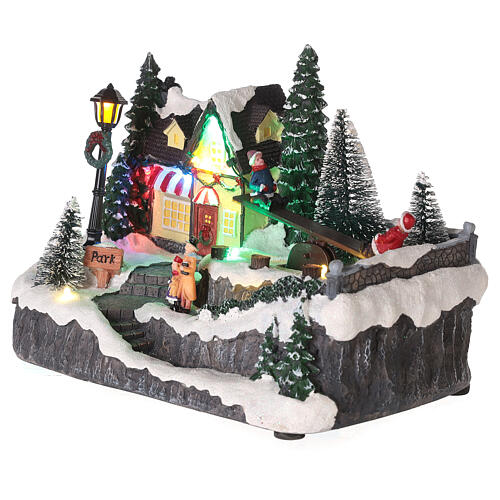 Christmas village set with animated swing 6x8x6 in 3