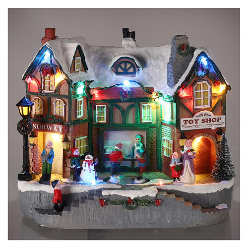 Christmas village set: building and skaters in motion 8x10x6 in 2