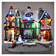 Christmas village set: building and skaters in motion 8x10x6 in s2