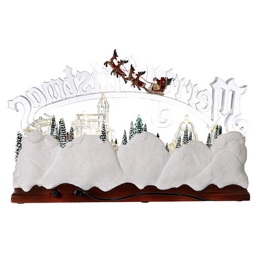 Christmas village set: clear buildings and inscription and skaters in motion 10x16x6 in 5