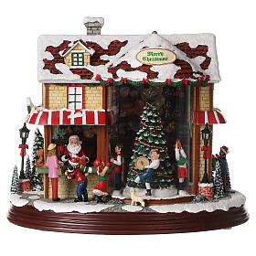 Christmas village set: Santa's shop with Christmas tree in motion 10x12x6 in
