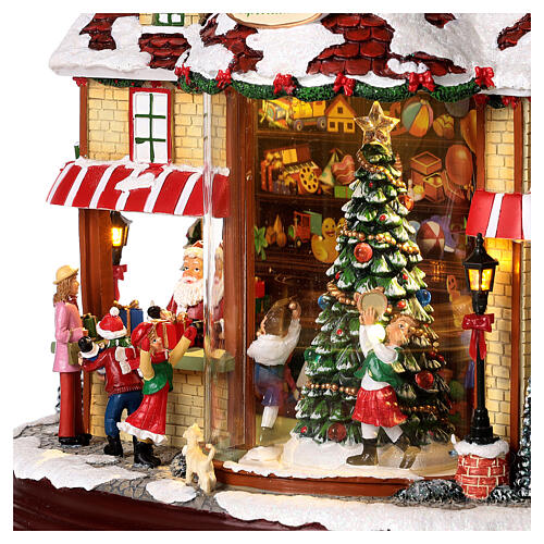 Christmas village set: Santa's shop with Christmas tree in motion 10x12x6 in 4