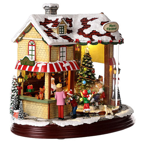 Christmas village set: Santa's shop with Christmas tree in motion 10x12x6 in 7