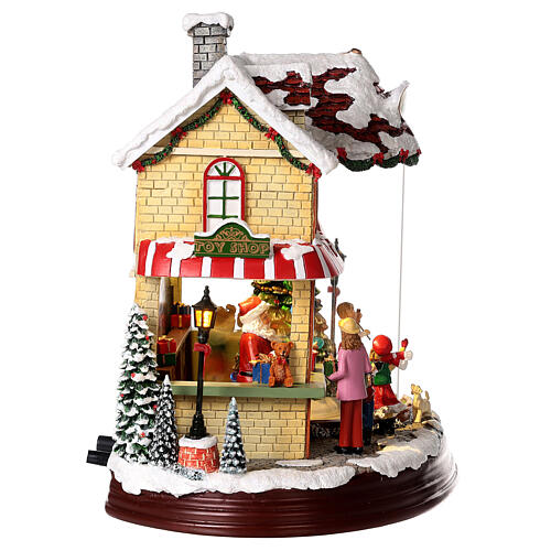 Christmas village set: Santa's shop with Christmas tree in motion 10x12x6 in 8