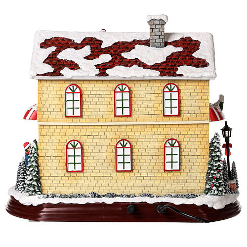 Christmas village set: Santa's shop with Christmas tree in motion 10x12x6 in 10