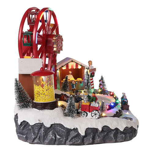 Christmas village set: big wheel and sleds in motion 12x16x10 in 5