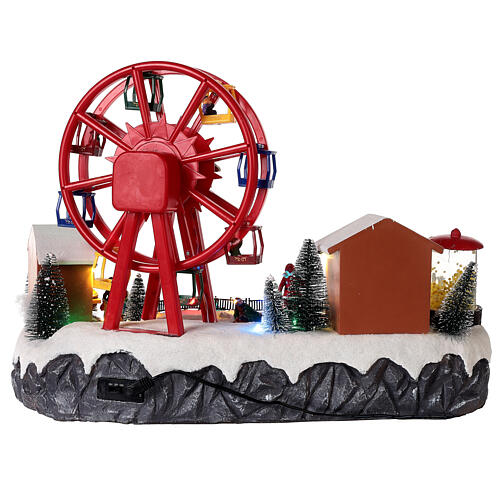 Christmas village set: big wheel and sleds in motion 12x16x10 in 7