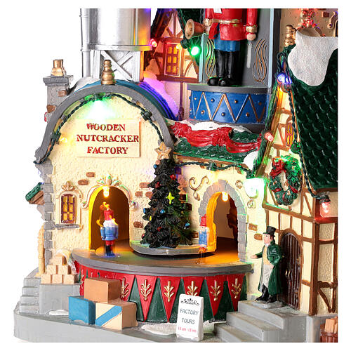 Christmas village set: wooden nutcracker factory with lights and animations, 12x12x8 in 4