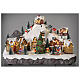 Christmas village set with skiers and Christmas tree in motion 12x16x10 in s2