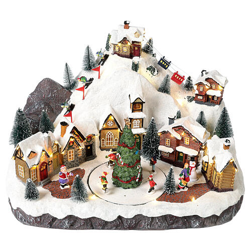 Village de Noël avec skieurs et sapin mouvement 30x40x25 cm 3