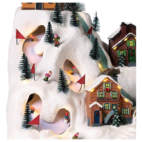 Christmas village set: skiers and river 14x12x8 in 3