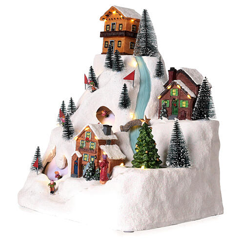Christmas village with skiers and river 35x30x20 cm 4