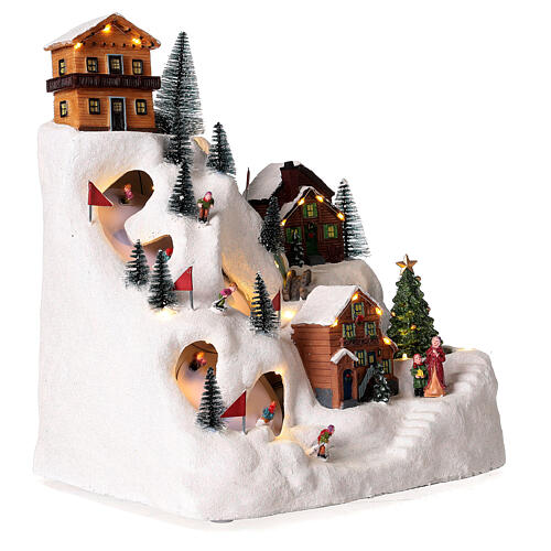 Christmas village with skiers and river 35x30x20 cm 5