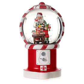 Boule à neige distributeur de bonbons avec Père Noël et elfe 20 cm