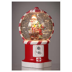 Boule à neige distributeur de bonbons avec Père Noël et elfe 20 cm