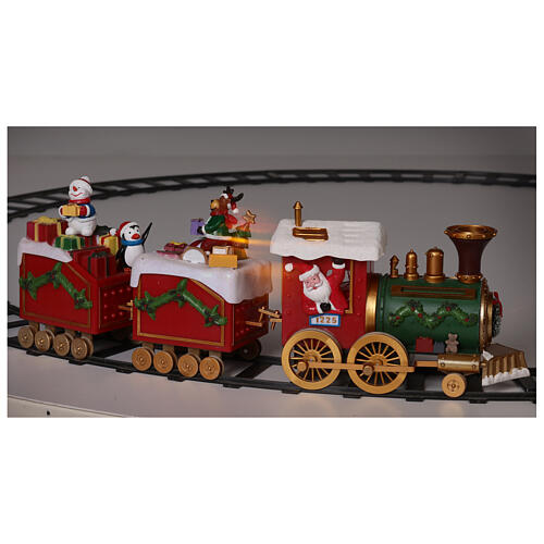 Zug mit Weihnachtsmann in Bewegung mit Lichtern, 50x15x35 14