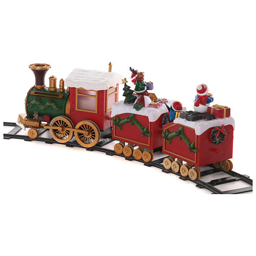 Zug mit Weihnachtsmann in Bewegung mit Lichtern, 50x15x35 18
