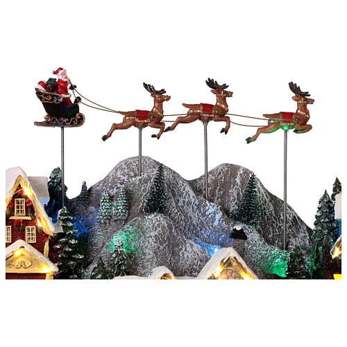 Weihnachtsdorf Weihnachtsmann auf Schlitten mit Rentier, 40x60x30 cm 6