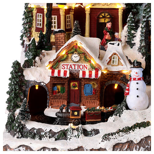 Christmas village set with Santa Claus on his sleigh 16x24x12 in 4