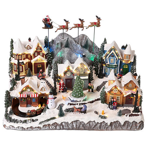 Village de Noël avec Père Noël en traineau 40x60x30 cm 3