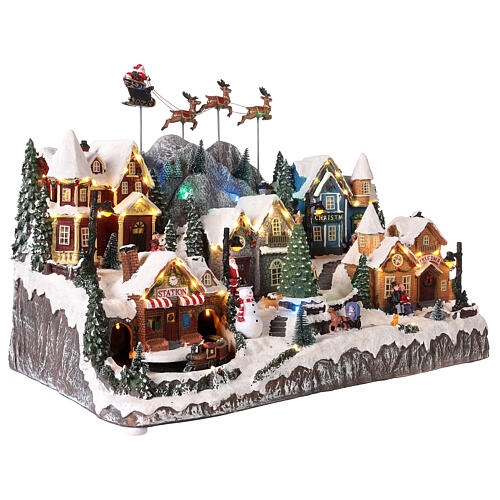 Village de Noël avec Père Noël en traineau 40x60x30 cm 7