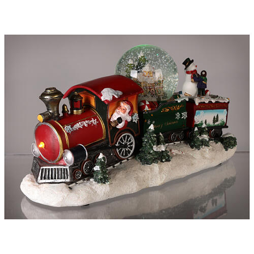Petit train de Noël avec boule à neige, animation et lumières 20x35x10 cm 4