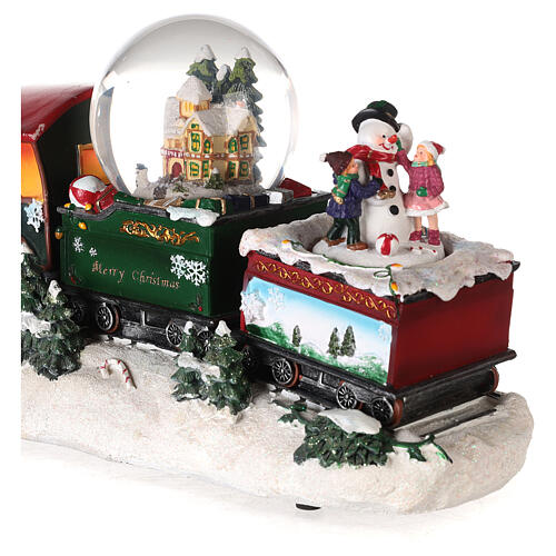 Petit train de Noël avec boule à neige, animation et lumières 20x35x10 cm 5