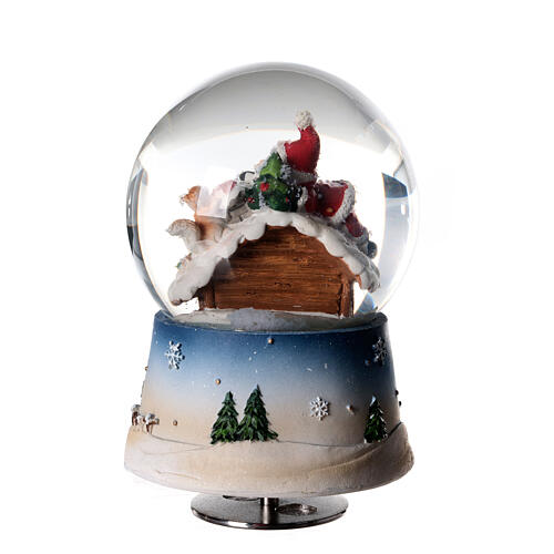 Glitter snow globe snowman fire music 15x10x10 cm