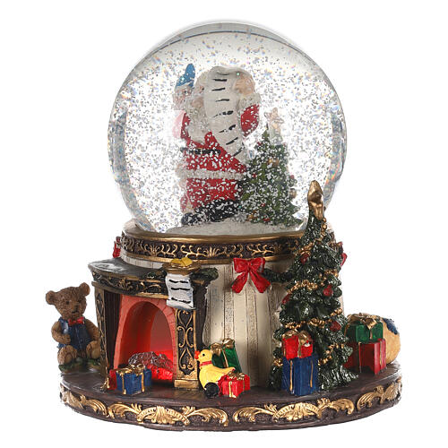 Schneekugel aus Glas mit Weihnachtsmann Feuer und Geschenken, 20x15x15 cm 3