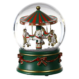 Snow globe with green carousel and white horses, snow and music box, 6x5 in