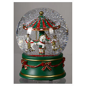 Snow globe with green carousel and white horses, snow and music box, 6x5 in