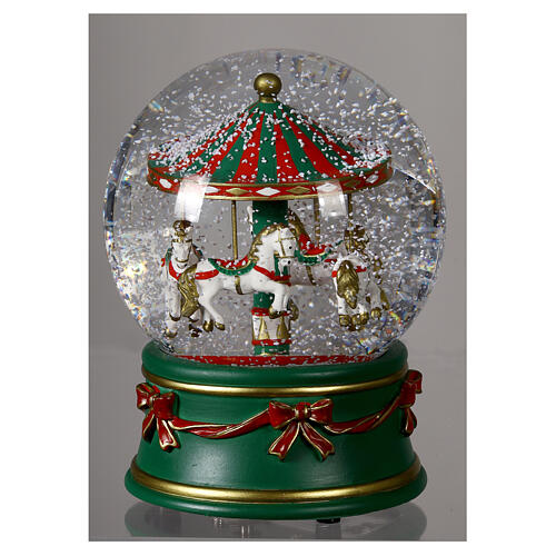 Snow globe with green carousel and white horses, snow and music box, 6x5 in 2
