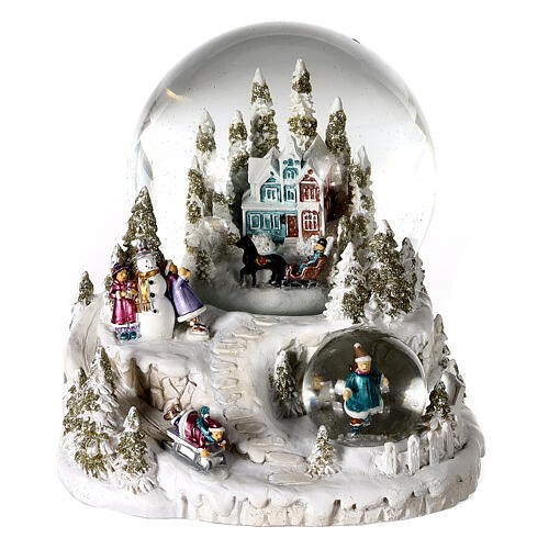 Snow globe with blue and red villa, double globe and sled, 6x6x6 in 1