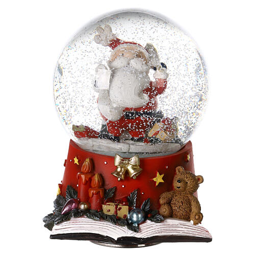 Snow globe with Santa Claus on an open book, music box, 15x10x10 cm 2