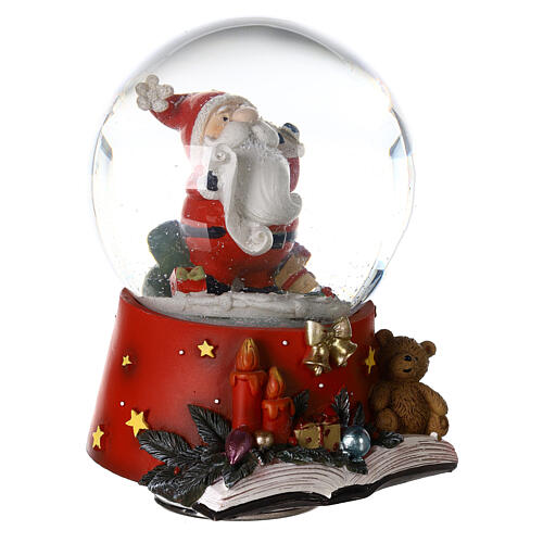 Snow globe with Santa Claus on an open book, music box, 15x10x10 cm 5