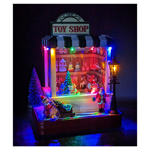 Weihnachtsspielzeugladen, Beleuchtung, Bewegung und Musik, 25x15x5 cm 2