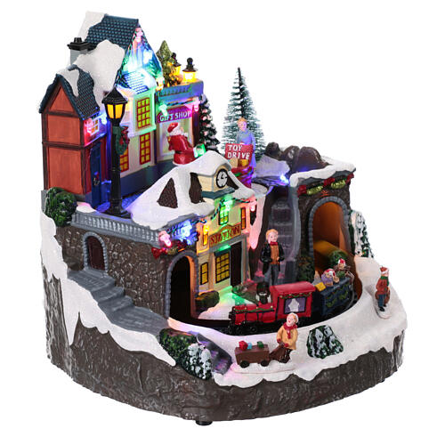 Christmas village toy shop and moving train 25x25x25 cm 5