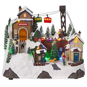 Christmas village setting with skiers and chairlift, 10x12x8 in