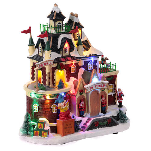 Christmas village set: toyshop with animated cars, 12x6x6 in 4