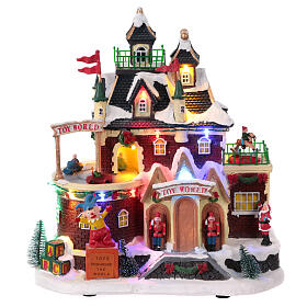 Christmas Village toy shop with moving cars 30x30x15 cm