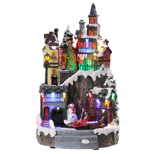 Christmas village set on two levels with train in motion, 14x8x8 in 1