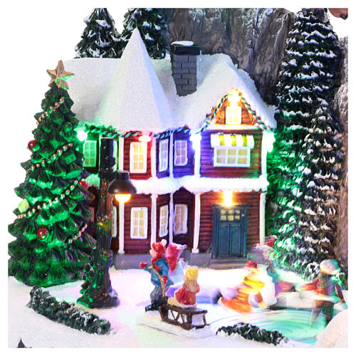 Christmas village with ice rink and Santa Claus, 10x16x10 in 4