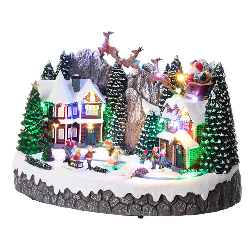Villaggio di Natale con pista di pattinaggio e Babbo Natale 25x40x25 cm 3