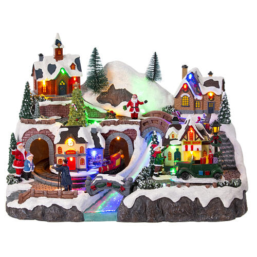Christmas village set with train and car in motion, 12x16x10 in 1