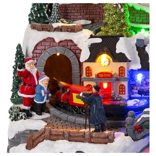 Christmas village set with train and car in motion, 12x16x10 in 3